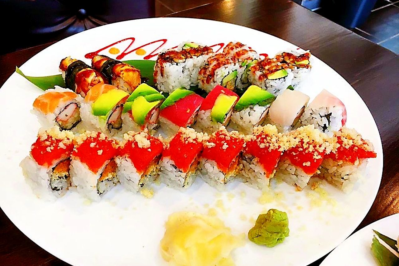 Sushi King specialty rolls on a white platter